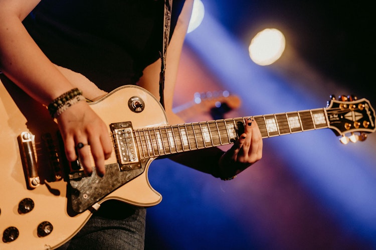 School of Rock student playing the guitar