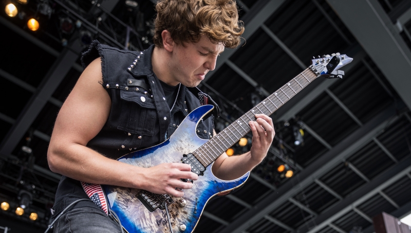 School of Rock guitar student performing on stage