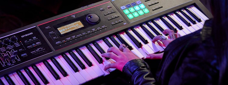 Kid learns to play piano at School of Rock Carmichael