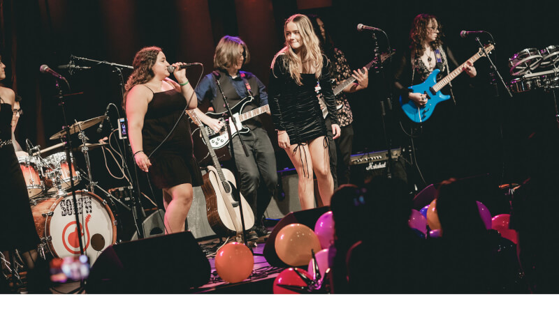 School of Rock students performing on stage